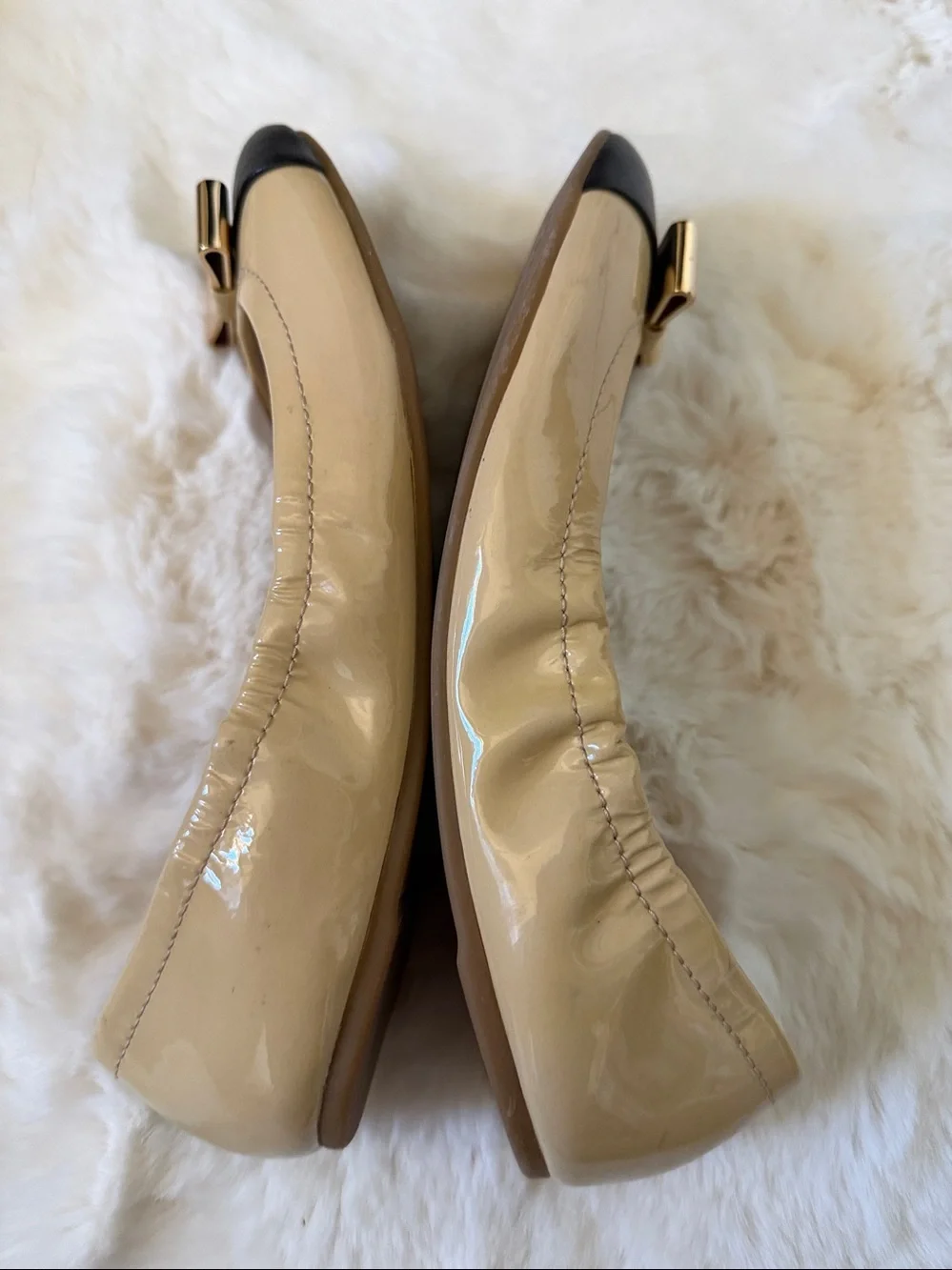 Coach Two-Tone Patent Leather Ballet Flats in Beige and Black with Gold Bow